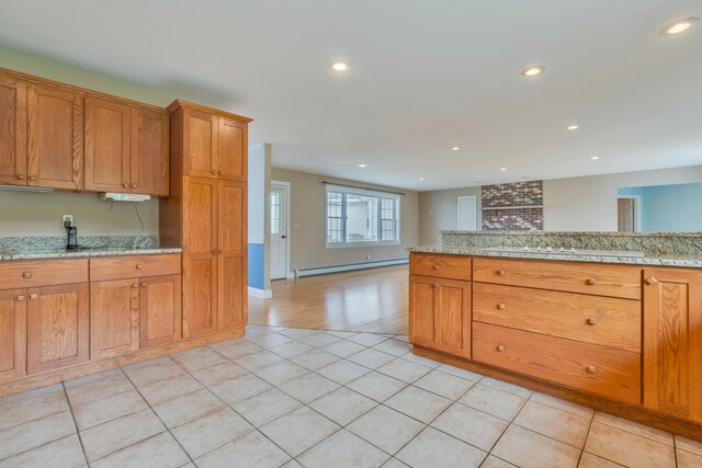 30 Apple Hill Vw, Alfred, ME 04002 - kitchen featuring baseboard heating, recessed lighting, light tile patterned floors, and brown cabinets