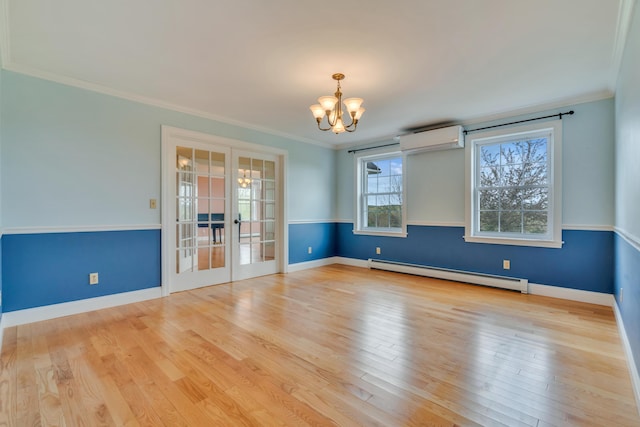 30 Apple Hill Vw, Alfred, ME 04002 - spare room with a baseboard radiator, an AC wall unit, a chandelier, french doors, and wood finished floors