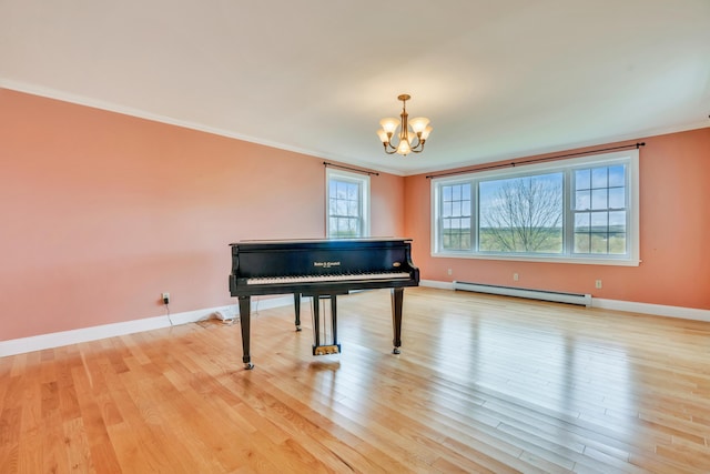 30 Apple Hill Vw, Alfred, ME 04002 - living area featuring a baseboard radiator, a chandelier, crown molding, light wood finished floors, and baseboards