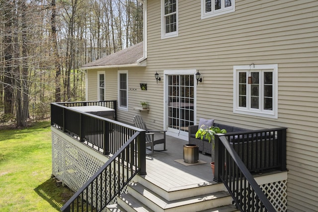 wooden deck featuring a yard
