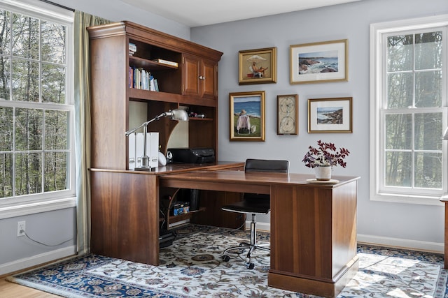 home office with baseboards and plenty of natural light