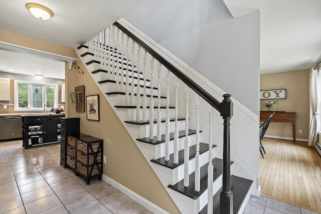 stairs with tile patterned flooring and baseboards