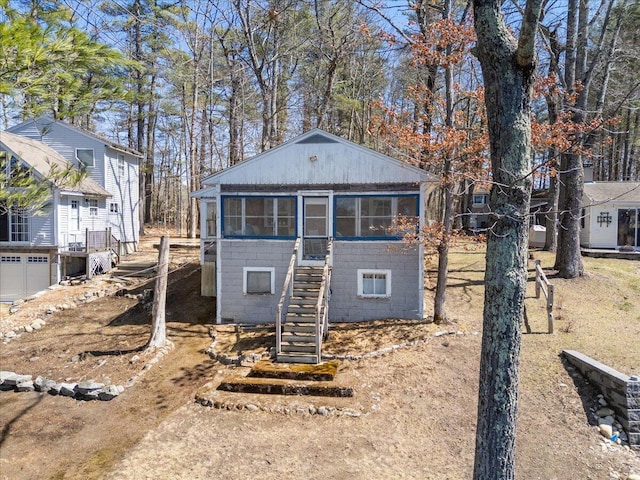 148 Anglers Rd, Windham, ME 04062 - back of property with stairway and a sunroom
