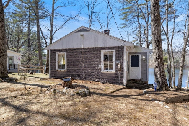 148 Anglers Rd, Windham, ME 04062 - back of house with fence, a chimney, and entry steps