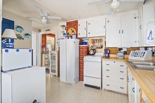 148 Anglers Rd, Windham, ME 04062 - kitchen with white cabinets, a ceiling fan, a sink, and white range oven