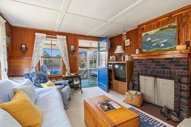 148 Anglers Rd, Windham, ME 04062 - living room with light carpet, wooden walls, and a fireplace