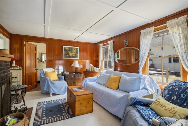 148 Anglers Rd, Windham, ME 04062 - living area with wood walls, light colored carpet, and a healthy amount of sunlight