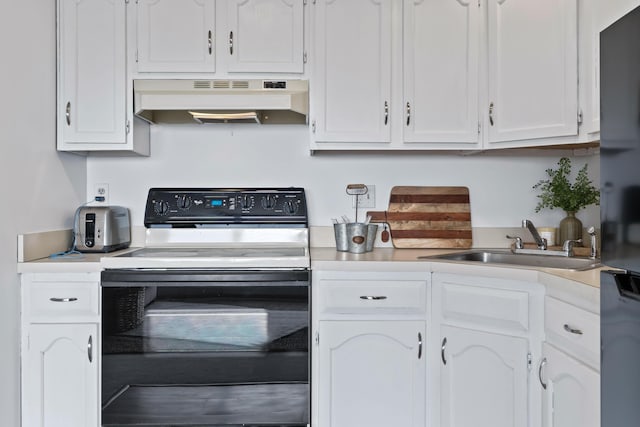 kitchen with electric stove, a sink, white cabinetry, light countertops, and under cabinet range hood
