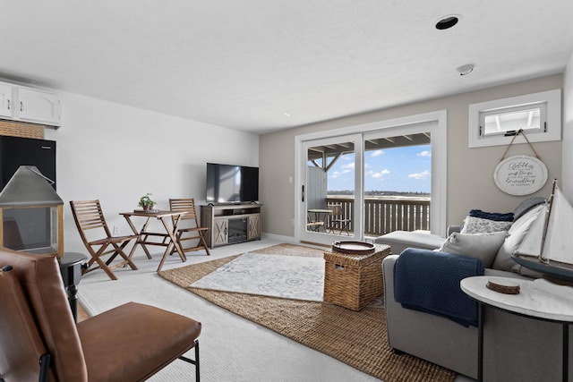 living room with baseboards and carpet