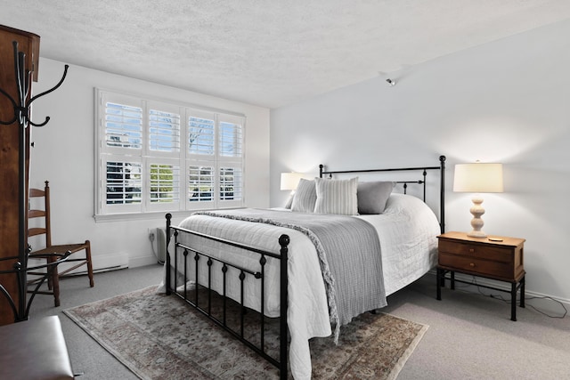 carpeted bedroom featuring baseboards and a textured ceiling