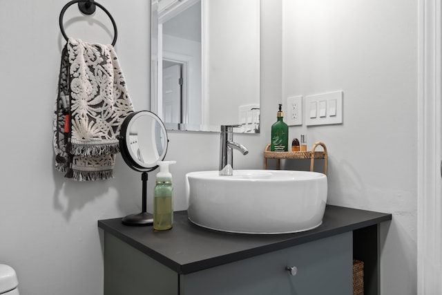 half bath featuring vanity