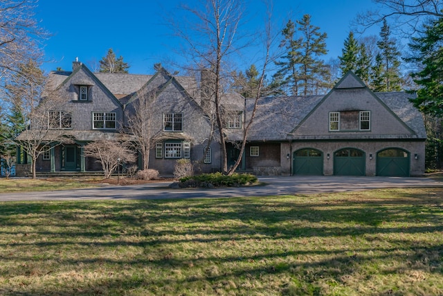 184 Spruce Point Rd, Yarmouth, ME 04096 - view of front of house with a front lawn, aphalt driveway, and an attached garage