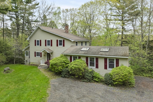 175 Quail Run Rd, Bristol, ME 04539 - traditional-style house with a chimney, a front lawn, and a shingled roof