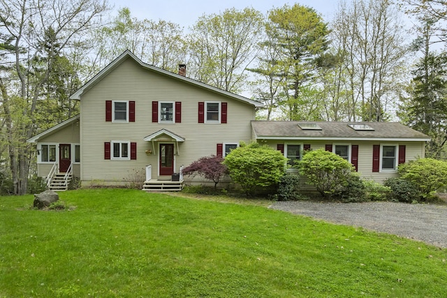 175 Quail Run Rd, Bristol, ME 04539 - view of front of house with a chimney and a front lawn