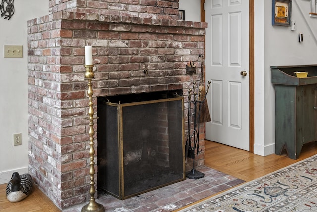 175 Quail Run Rd, Bristol, ME 04539 - detailed view of a fireplace, baseboards, and wood finished floors
