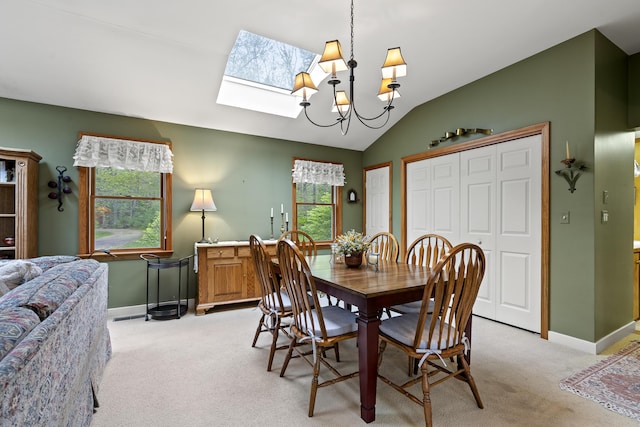 175 Quail Run Rd, Bristol, ME 04539 - dining area with a skylight, light carpet, baseboards, lofted ceiling, and a chandelier