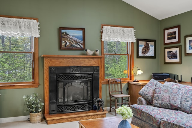 175 Quail Run Rd, Bristol, ME 04539 - living area with vaulted ceiling, baseboards, and a tile fireplace