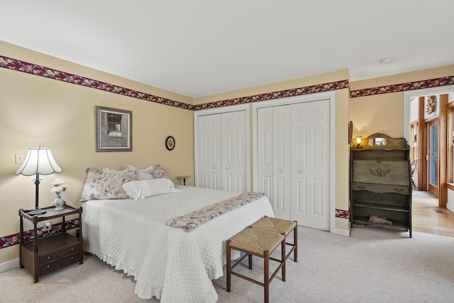 175 Quail Run Rd, Bristol, ME 04539 - bedroom featuring multiple closets, light colored carpet, and baseboards
