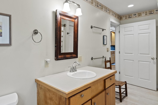 175 Quail Run Rd, Bristol, ME 04539 - bathroom featuring vanity, toilet, and wood finished floors