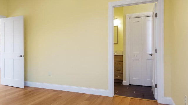 LOT16 Beech St Unit 16, Hallowell, ME 04347 - unfurnished bedroom featuring baseboards, wood finished floors, and a closet