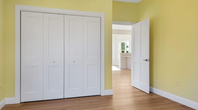 LOT16 Beech St Unit 16, Hallowell, ME 04347 - unfurnished bedroom featuring light wood-style flooring, a closet, and baseboards