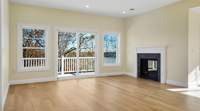 LOT16 Beech St Unit 16, Hallowell, ME 04347 - unfurnished living room with recessed lighting, a fireplace, baseboards, and light wood-style flooring