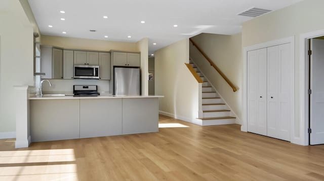LOT16 Beech St Unit 16, Hallowell, ME 04347 - kitchen featuring visible vents, gray cabinets, baseboards, light wood-style flooring, and appliances with stainless steel finishes