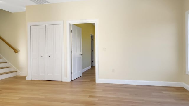 LOT16 Beech St Unit 16, Hallowell, ME 04347 - unfurnished bedroom with light wood-style floors, a closet, baseboards, and visible vents