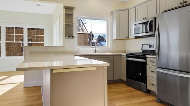 LOT16 Beech St Unit 16, Hallowell, ME 04347 - kitchen featuring a peninsula, light countertops, light wood finished floors, and stainless steel appliances