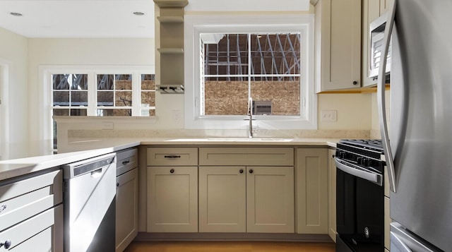 LOT16 Beech St Unit 16, Hallowell, ME 04347 - kitchen featuring a sink, dishwasher, white microwave, black gas range, and freestanding refrigerator