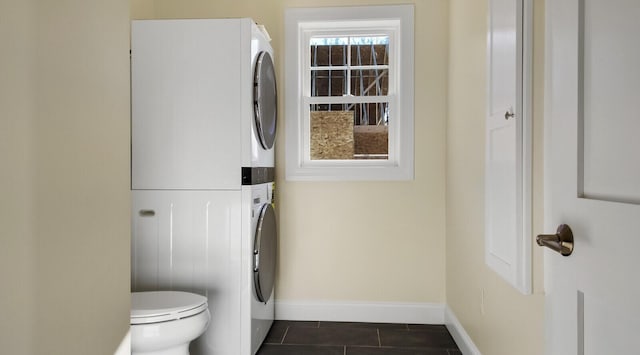 LOT16 Beech St Unit 16, Hallowell, ME 04347 - bathroom with tile patterned floors, baseboards, stacked washer / dryer, and toilet