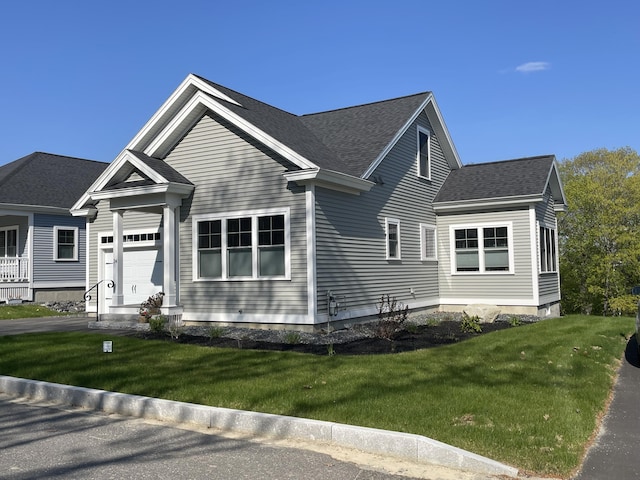 LOT16 Beech St Unit 16, Hallowell, ME 04347 - view of front of property featuring a shingled roof, a front lawn, and a garage