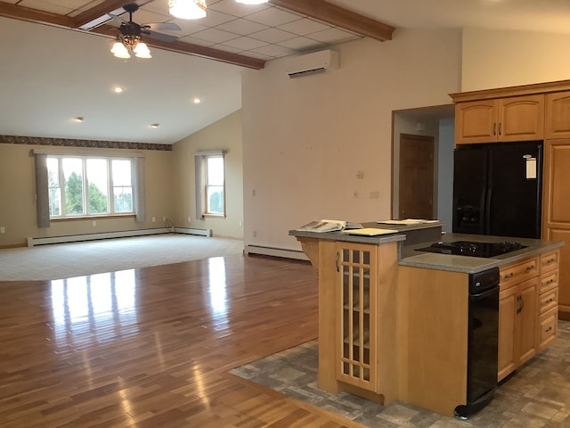 kitchen with a wall mounted air conditioner, a baseboard radiator, black appliances, open floor plan, and ceiling fan