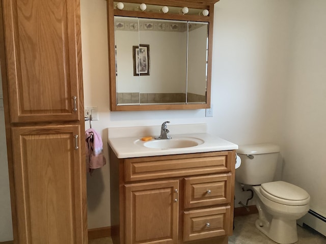 half bath with baseboard heating, toilet, vanity, and baseboards