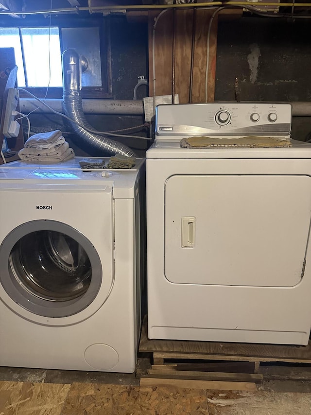 laundry room featuring washer and dryer and laundry area