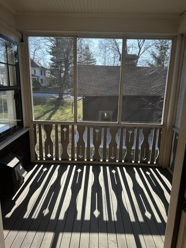 unfurnished sunroom with plenty of natural light