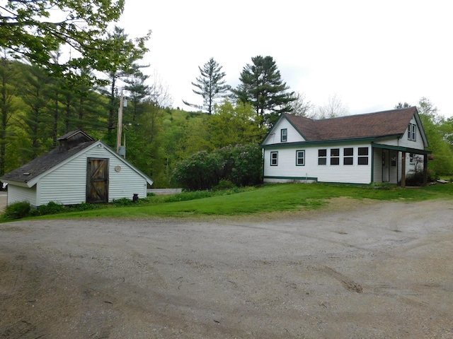 346 Bear River Rd, Newry, ME 04261 - view of side of property with dirt driveway and a lawn