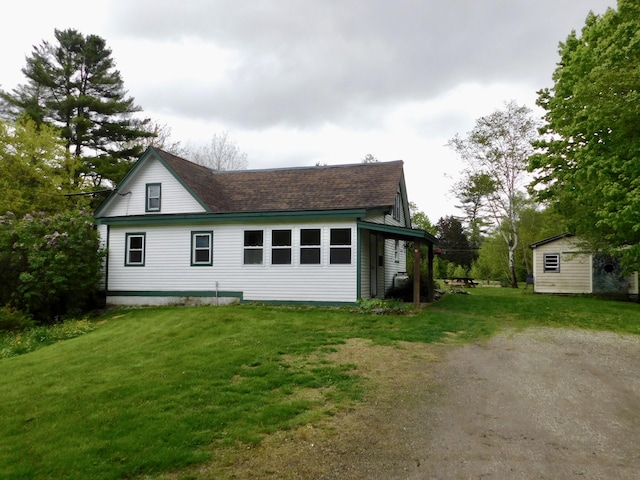 346 Bear River Rd, Newry, ME 04261 - view of side of property featuring a lawn, an outbuilding, roof with shingles, and driveway