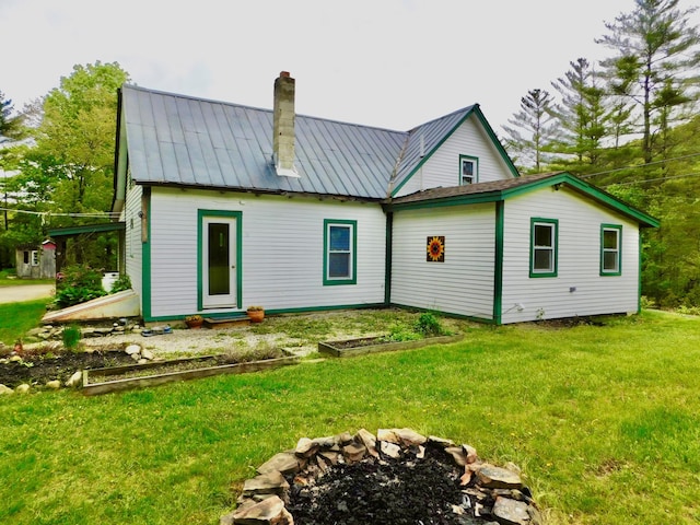 346 Bear River Rd, Newry, ME 04261 - back of property with a chimney, a lawn, a metal roof, and a standing seam roof