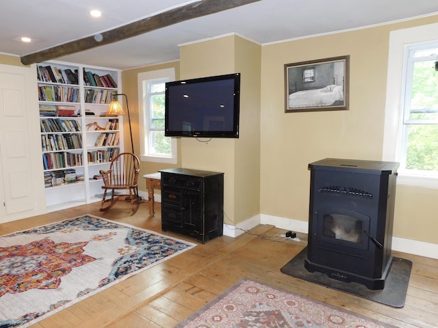346 Bear River Rd, Newry, ME 04261 - living room featuring hardwood / wood-style floors, a wood stove, healthy amount of natural light, crown molding, and beam ceiling