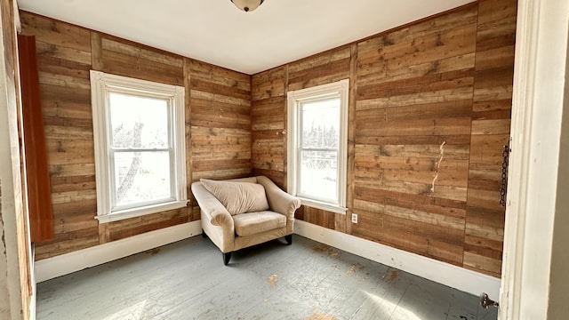 11 Maple St, Milo, ME 04463 - sitting room with healthy amount of natural light, hardwood / wood-style flooring, wooden walls, and baseboards
