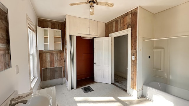 11 Maple St, Milo, ME 04463 - full bathroom featuring ceiling fan, a sink, and a bath