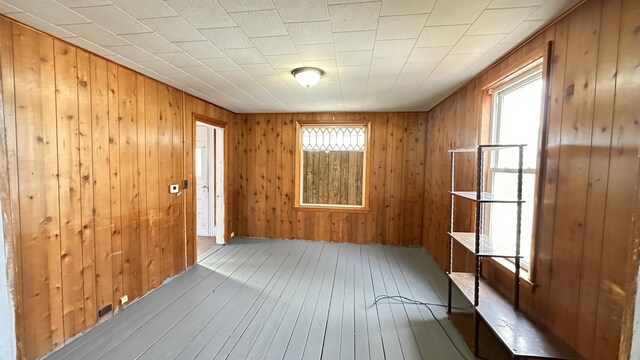 11 Maple St, Milo, ME 04463 - spare room featuring hardwood / wood-style flooring and wood walls