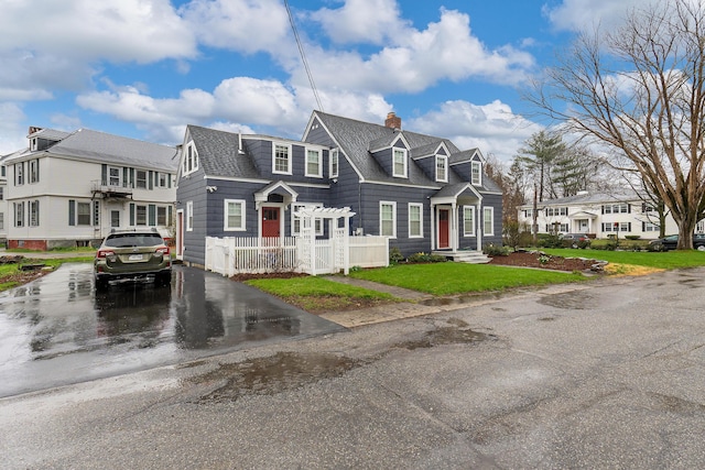1 Silver Ter, Waterville, ME 04901 - view of front facade with a chimney, a front yard, a residential view, a gate, and fence