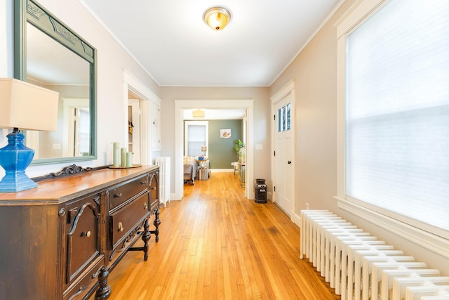 1 Silver Ter, Waterville, ME 04901 - hallway with baseboards, radiator heating unit, and light wood finished floors