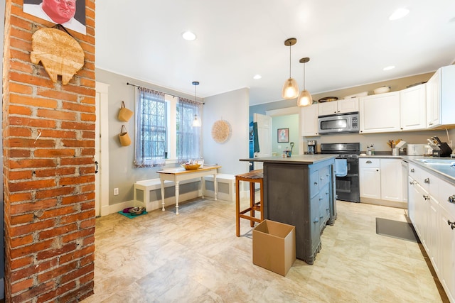 1 Silver Ter, Waterville, ME 04901 - kitchen with white cabinets, stainless steel microwave, double oven range, and a center island