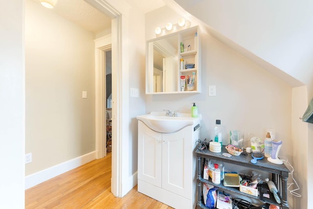 1 Silver Ter, Waterville, ME 04901 - bathroom with vanity, baseboards, and wood finished floors