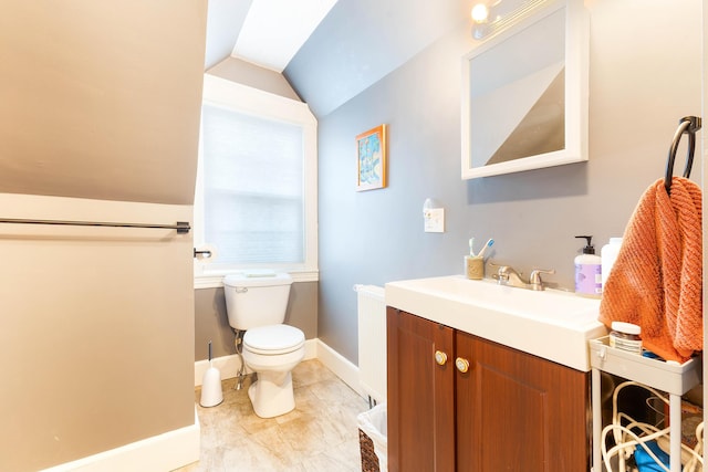 1 Silver Ter, Waterville, ME 04901 - bathroom featuring vanity, baseboards, vaulted ceiling, and toilet