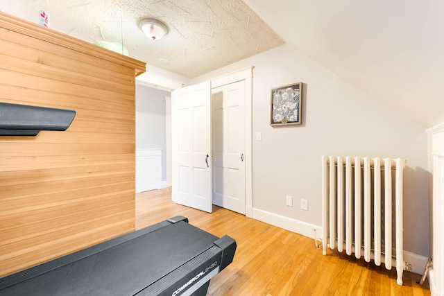 1 Silver Ter, Waterville, ME 04901 - workout room featuring radiator, baseboards, light wood finished floors, and lofted ceiling