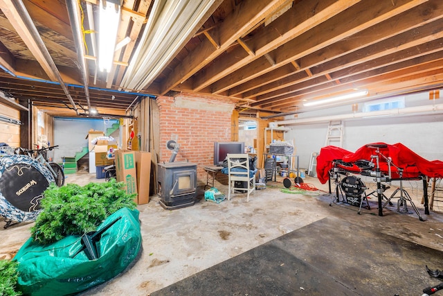 1 Silver Ter, Waterville, ME 04901 - unfinished basement featuring a wood stove